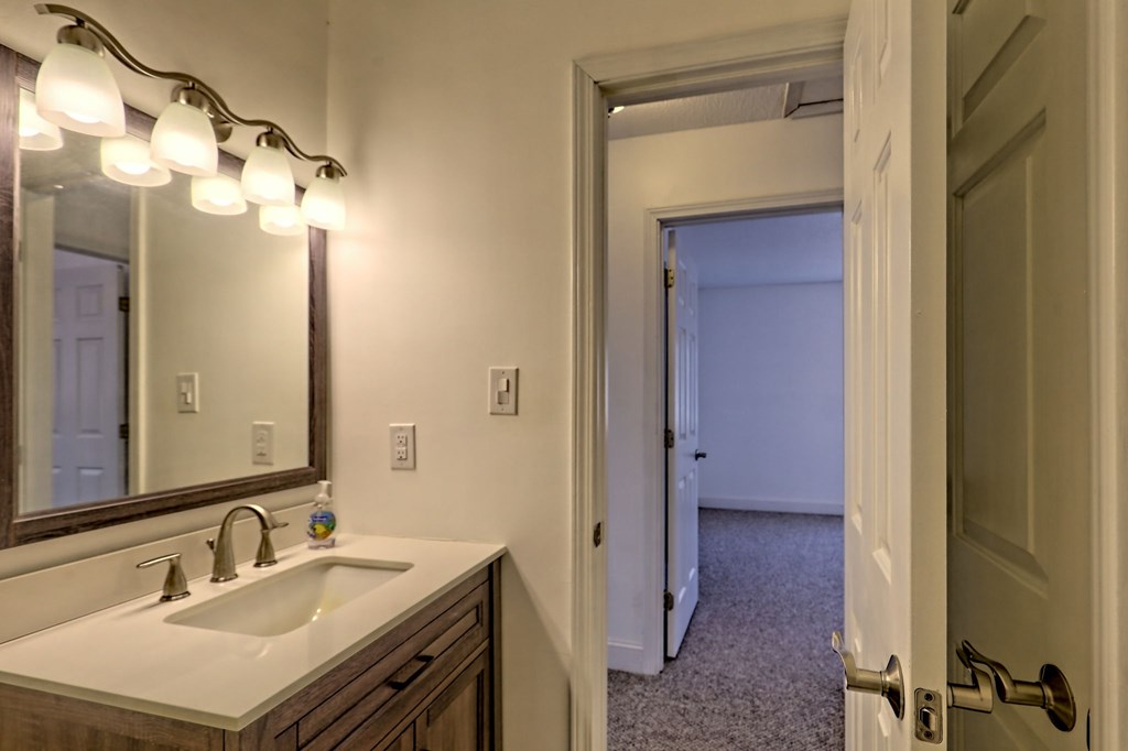 125 Moore View Drive Murphy, NC 28906 - Photo 43 of 49 a bathroom with a sink vanity and a mirror