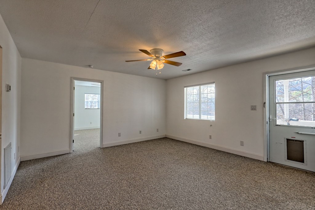 125 Moore View Drive Murphy, NC 28906 - Photo 47 of 49 an empty room with windows and ceiling fan