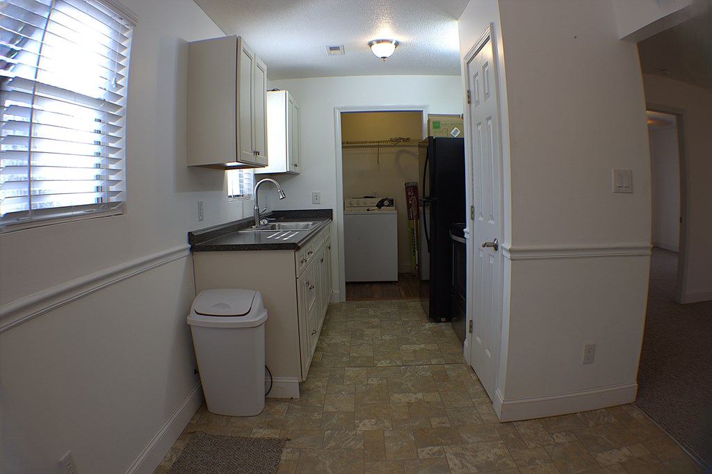 125 Moore View Drive Murphy, NC 28906 - Photo 8 of 49 a kitchen with a refrigerator a sink a washer and dryer