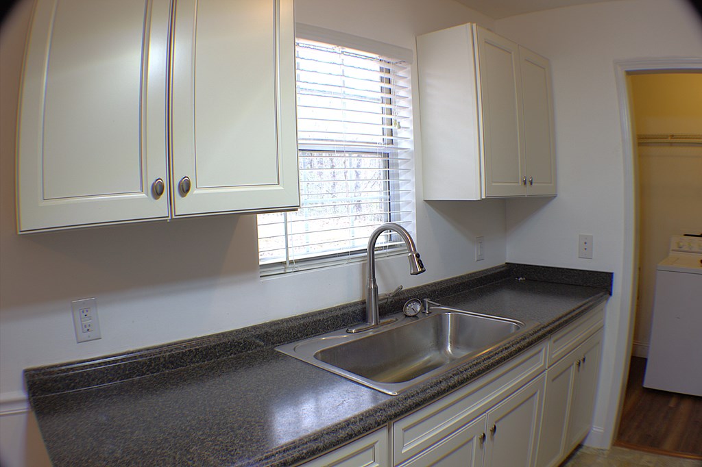 125 Moore View Drive Murphy, NC 28906 - Photo 9 of 49 a kitchen with granite countertop a sink stove and cabinets