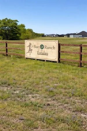 a view of a field with an ocean view