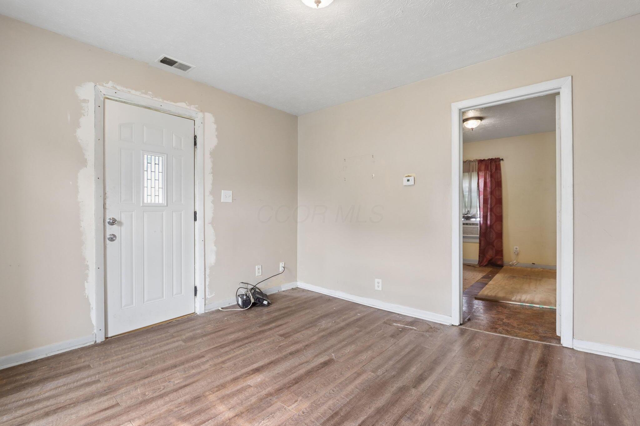 1128 Hilock Road Columbus, OH 43207 - Photo 21 of 29 Neutral wall tones with wood-finish flooring