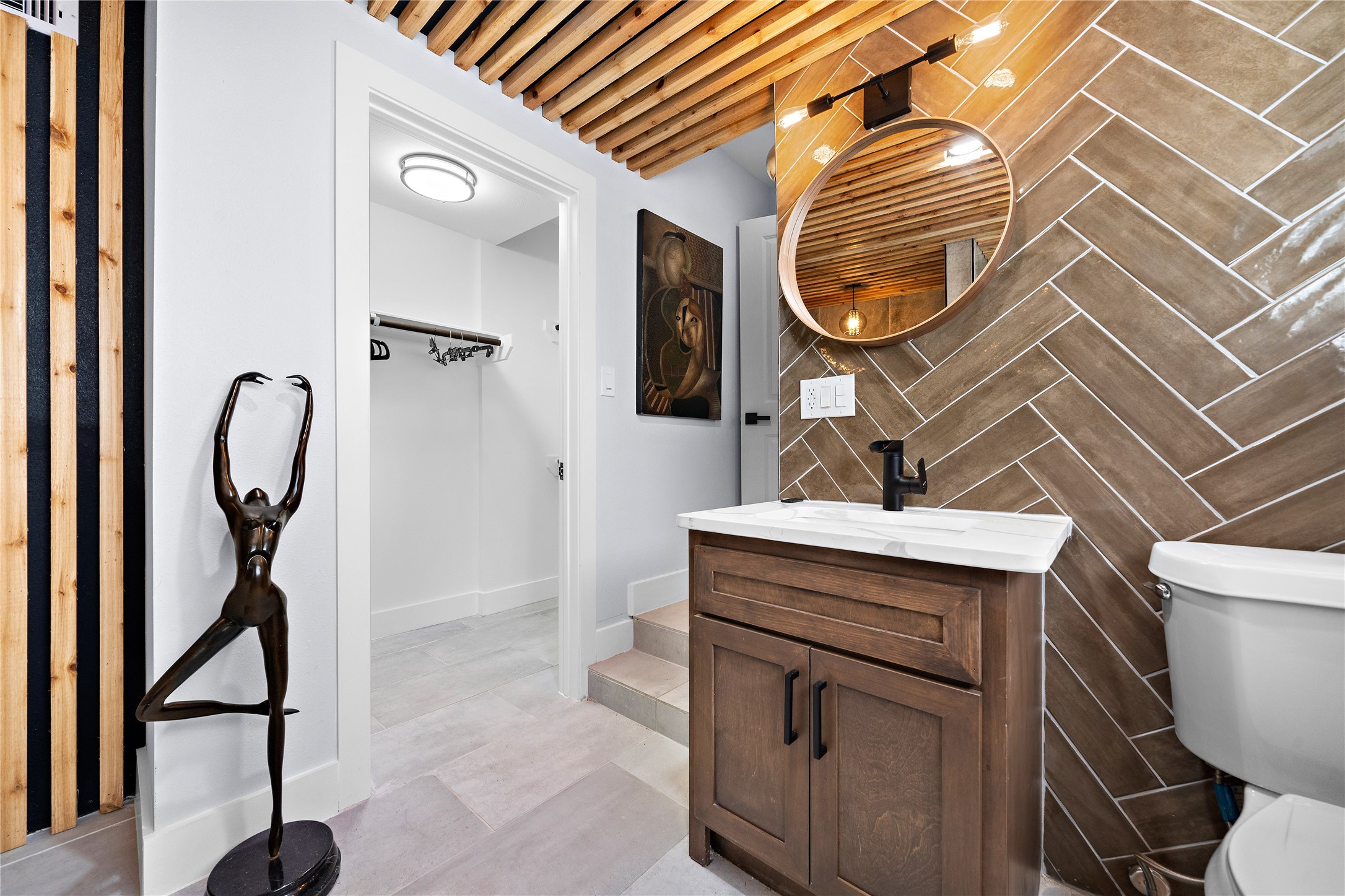3502 Ruth Street Houston, TX 77004 - Photo 5 of 20 a bathroom with a sink a mirror and a shower