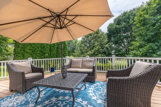 a living room with furniture kitchen and a table