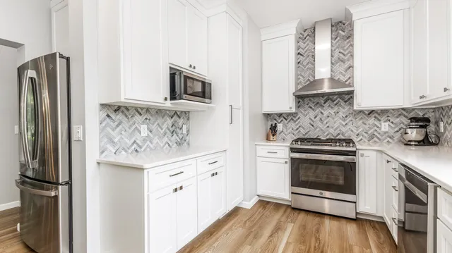 a bathroom with a sink vanity and mirror