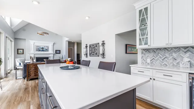 a spacious bedroom with a bed and a large window with outer view