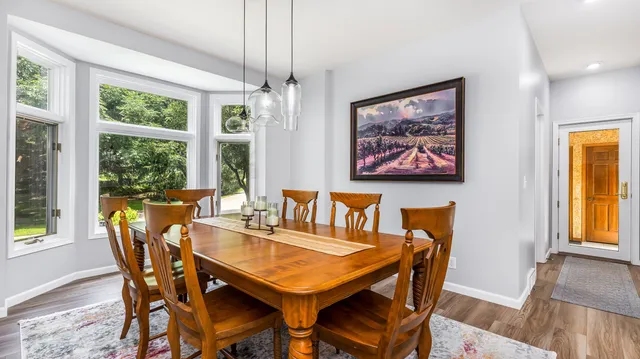 a bathroom with a shower and a sink a mirror