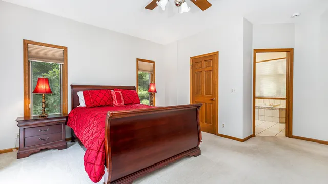 a bed room with a bed and a painting