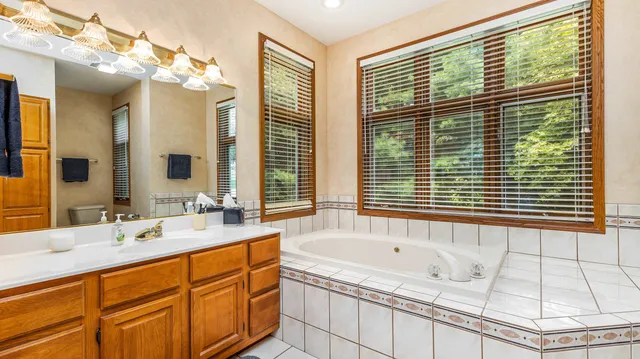 a living room with furniture and a dresser