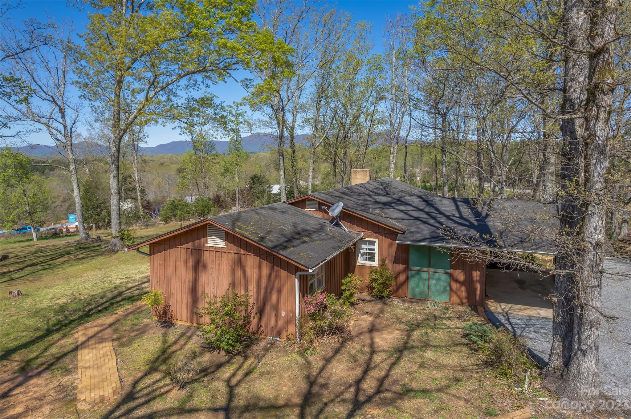 2330 Red Fox Road Tryon, NC 28782 - Photo 16 of 21 a view of a house with backyard stove and sitting area