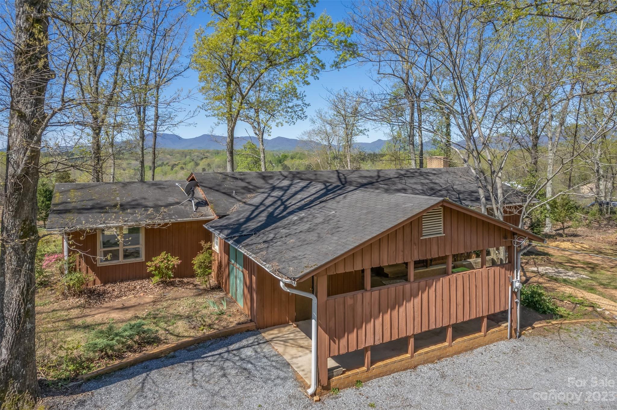 2330 Red Fox Road Tryon, NC 28782 - Photo 3 of 21 a roof deck with table and chairs under an umbrella