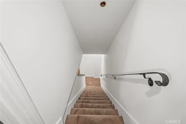 a view of an empty room with a fireplace