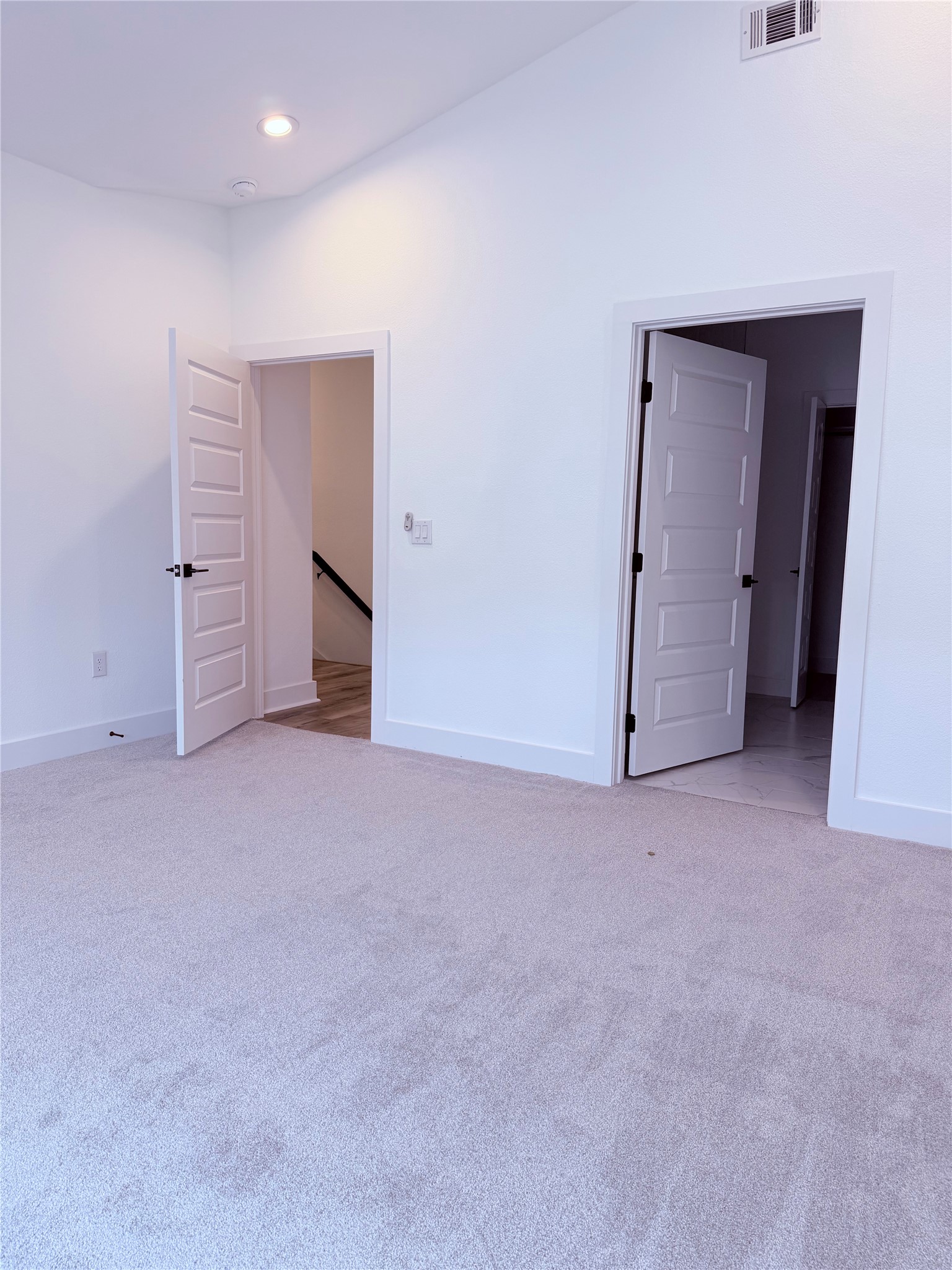 1417 Kramer Lane, Unit 7 Austin, TX 78758 - Photo 11 of 24 A well-lit room with fresh carpeting and ample entryways.