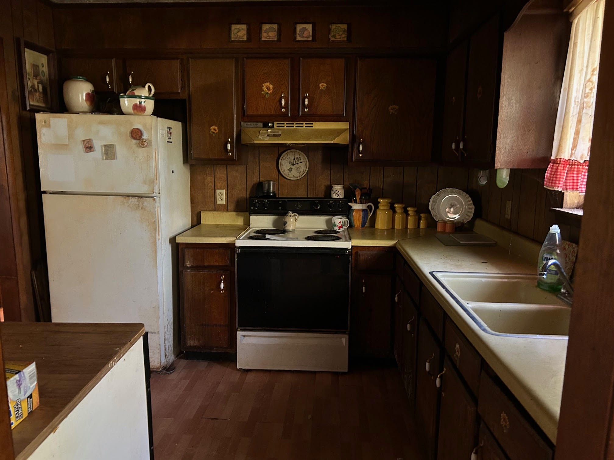 126 West Piney Road Dickson, TN 37055 - Photo 6 of 7 a kitchen with a sink and a refrigerator