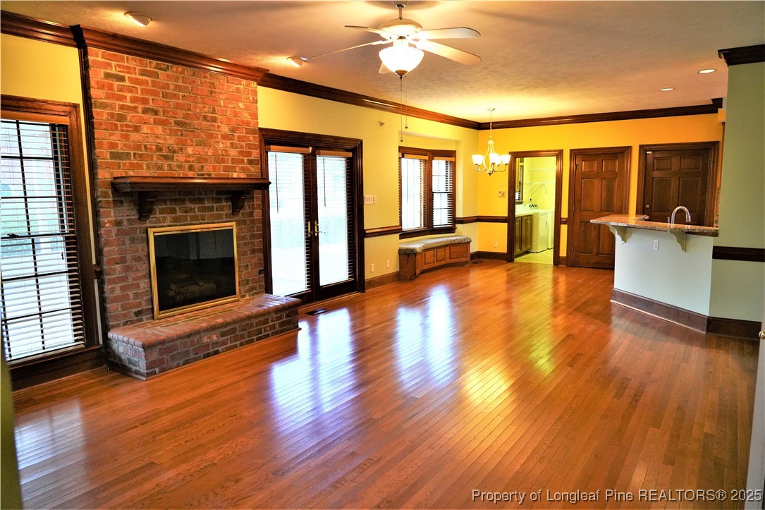 568 Broyhill Road Fayetteville, NC 28314 - Photo 14 of 37 a view of an empty room with wooden floor and a window