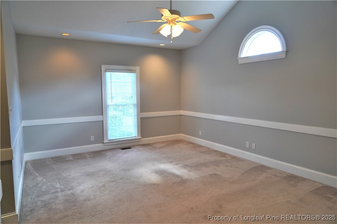 568 Broyhill Road Fayetteville, NC 28314 - Photo 17 of 37 an empty room with windows and fan