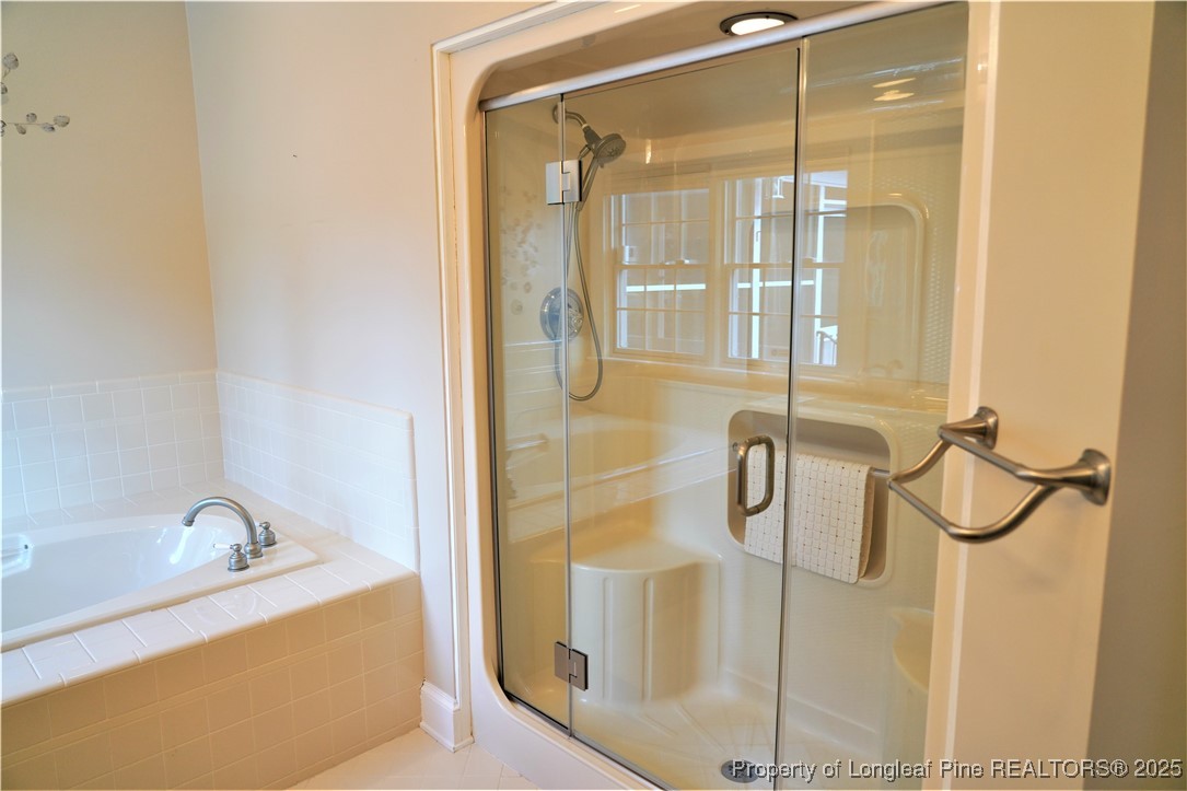 568 Broyhill Road Fayetteville, NC 28314 - Photo 21 of 37 a bathroom with a bathtub and shower