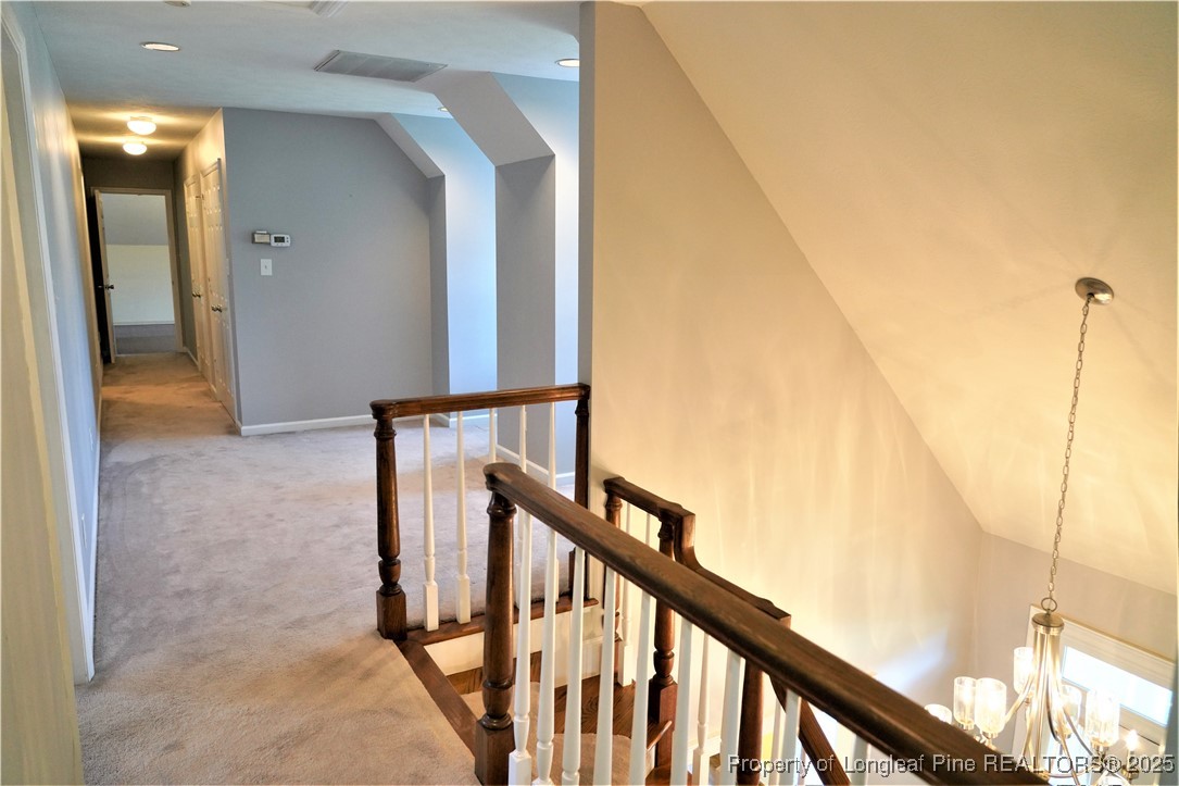 568 Broyhill Road Fayetteville, NC 28314 - Photo 23 of 37 a view of staircase with railing and white walls