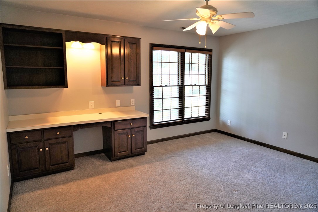 568 Broyhill Road Fayetteville, NC 28314 - Photo 27 of 37 a spacious bathroom with a double vanity sink a large mirror and a bathtub