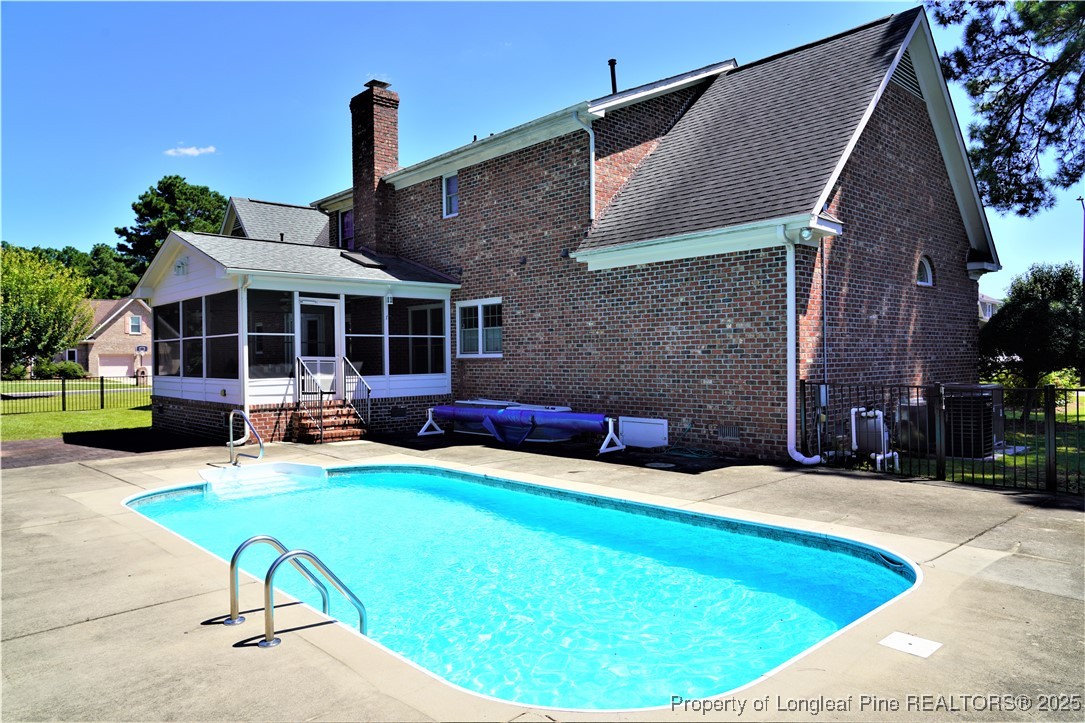 568 Broyhill Road Fayetteville, NC 28314 - Photo 35 of 37 a view of house with swimming pool outdoor seating