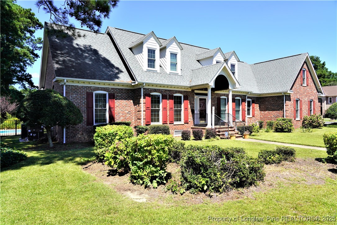 568 Broyhill Road Fayetteville, NC 28314 - Photo 37 of 37 front view of a brick house with a yard
