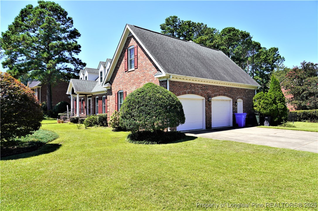 568 Broyhill Road Fayetteville, NC 28314 - Photo 4 of 37 a front view of a house with a yard