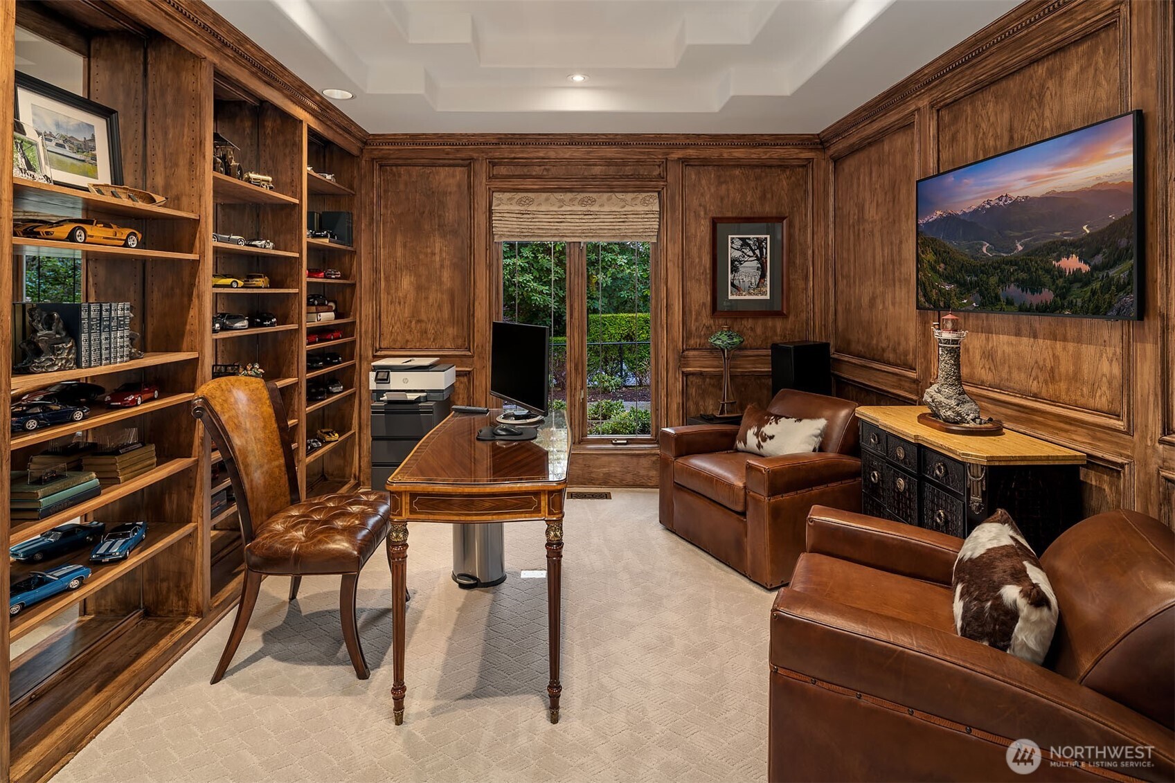 854 Evergreen Point Road Medina, WA 98039 - Photo 12 of 40 a living room with furniture a flat screen tv and floor to ceiling window
