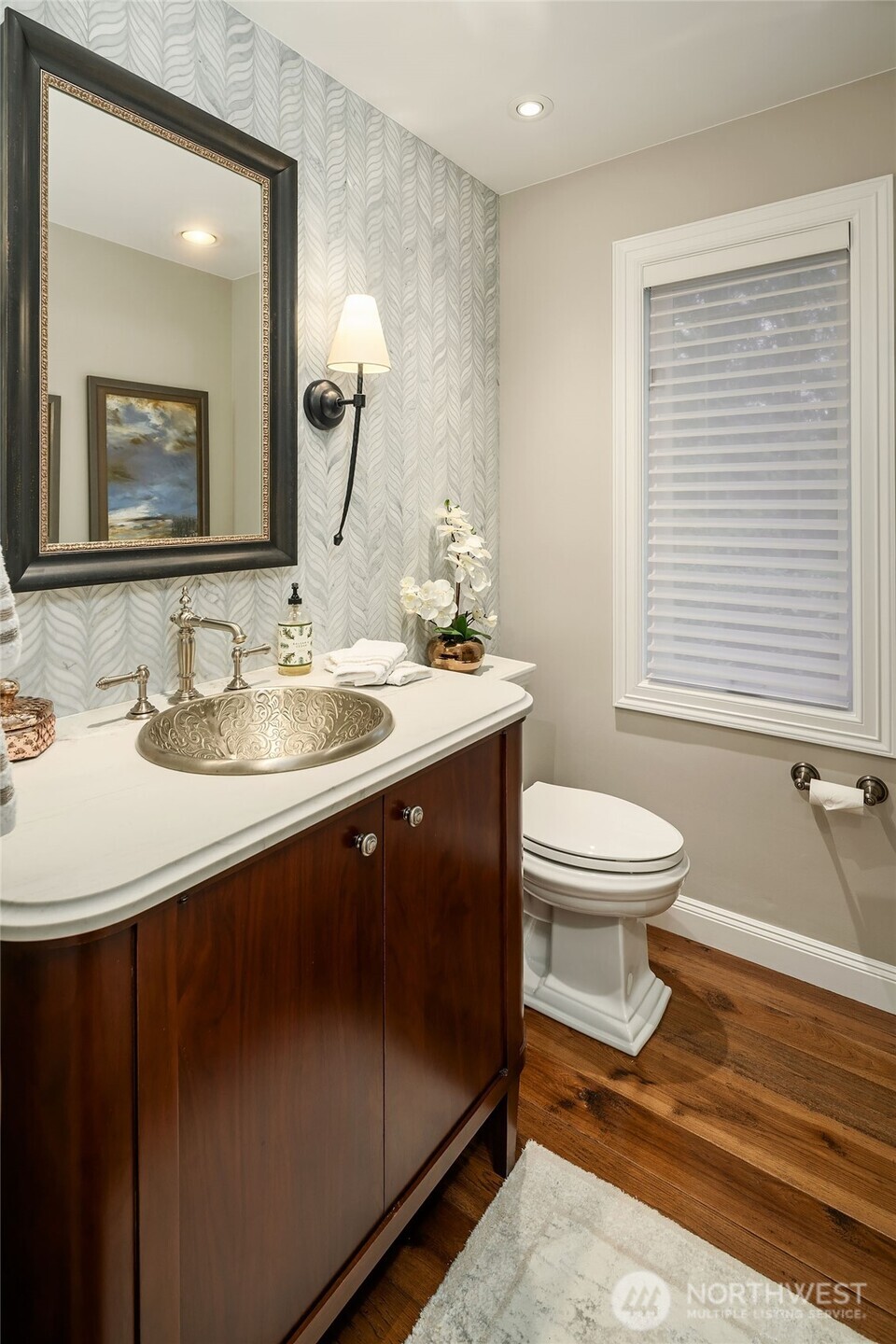 854 Evergreen Point Road Medina, WA 98039 - Photo 13 of 40 a bathroom with a sink toilet and mirror
