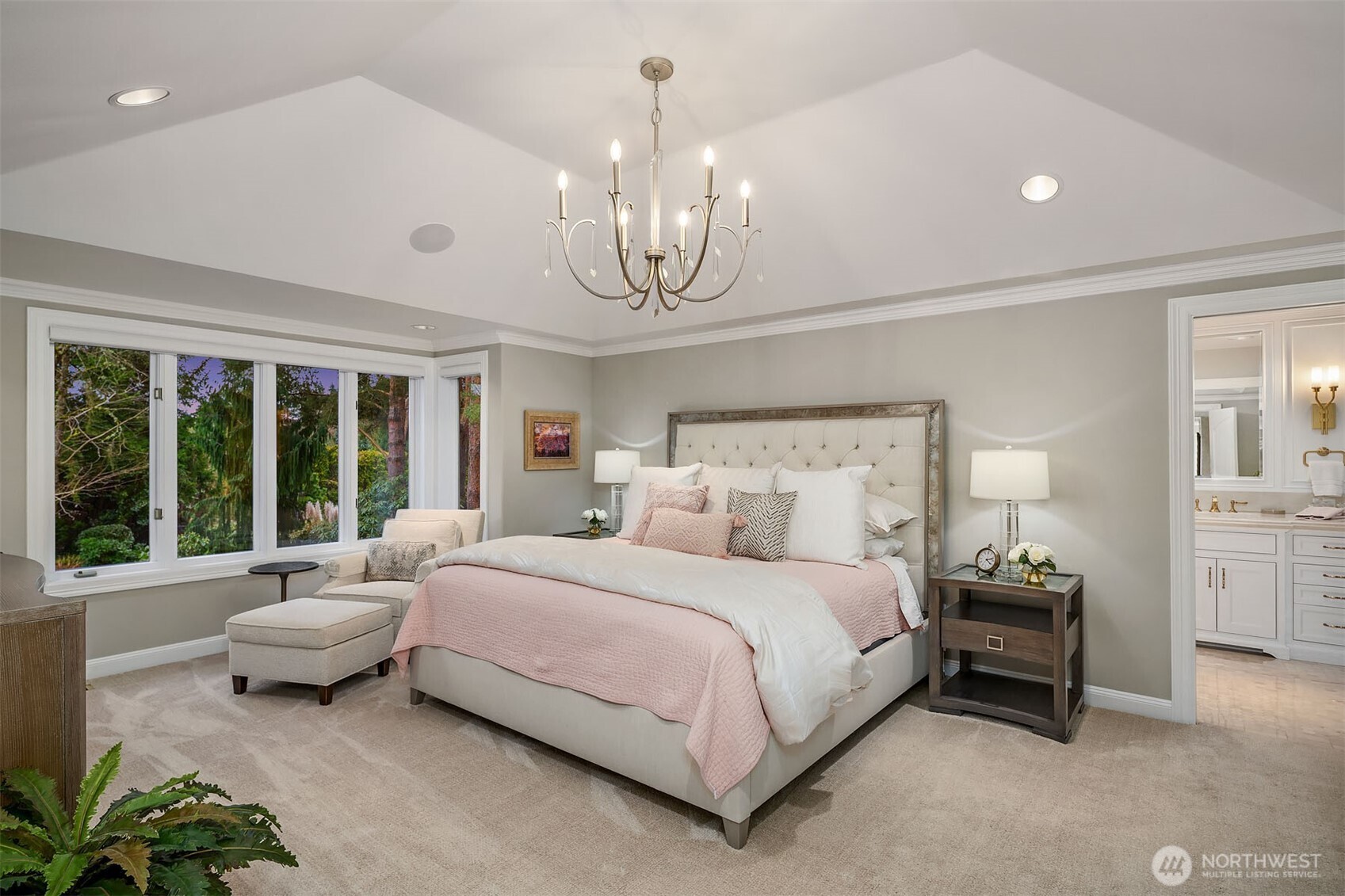 854 Evergreen Point Road Medina, WA 98039 - Photo 14 of 40 a bedroom with bed and a chandelier