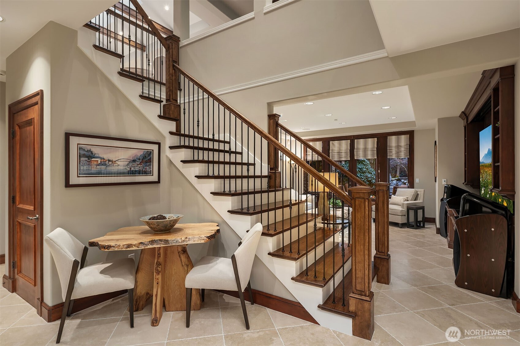 854 Evergreen Point Road Medina, WA 98039 - Photo 22 of 40 a dining room with furniture and a flat screen tv