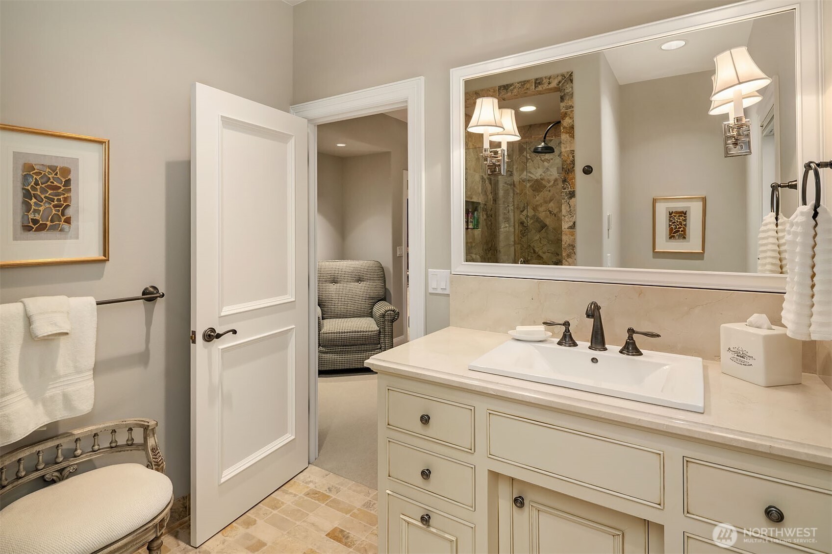 854 Evergreen Point Road Medina, WA 98039 - Photo 27 of 40 a bathroom with a toilet sink a mirror and shower