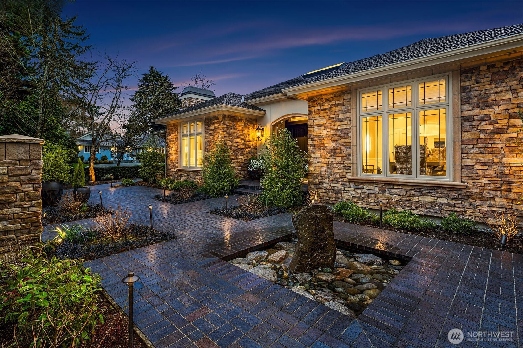854 Evergreen Point Road Medina, WA 98039 - Photo 3 of 40 a front view of a house with garden