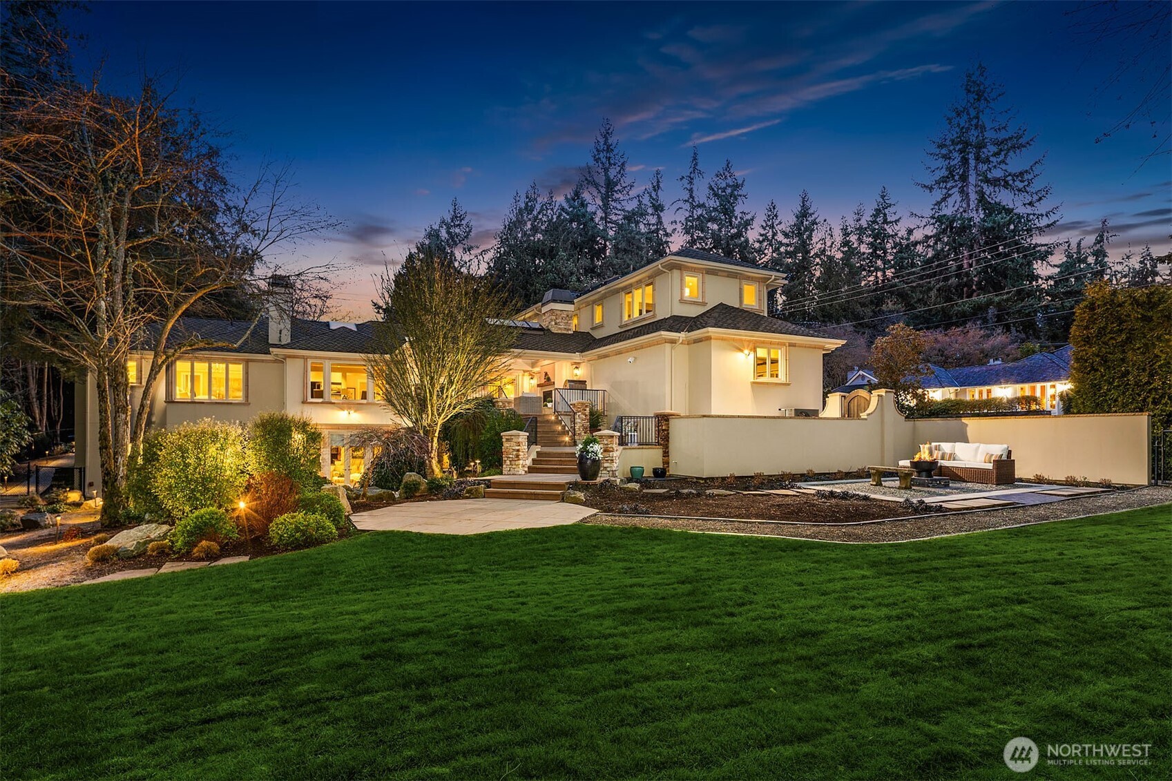 854 Evergreen Point Road Medina, WA 98039 - Photo 33 of 40 a front view of a house with patio and garden