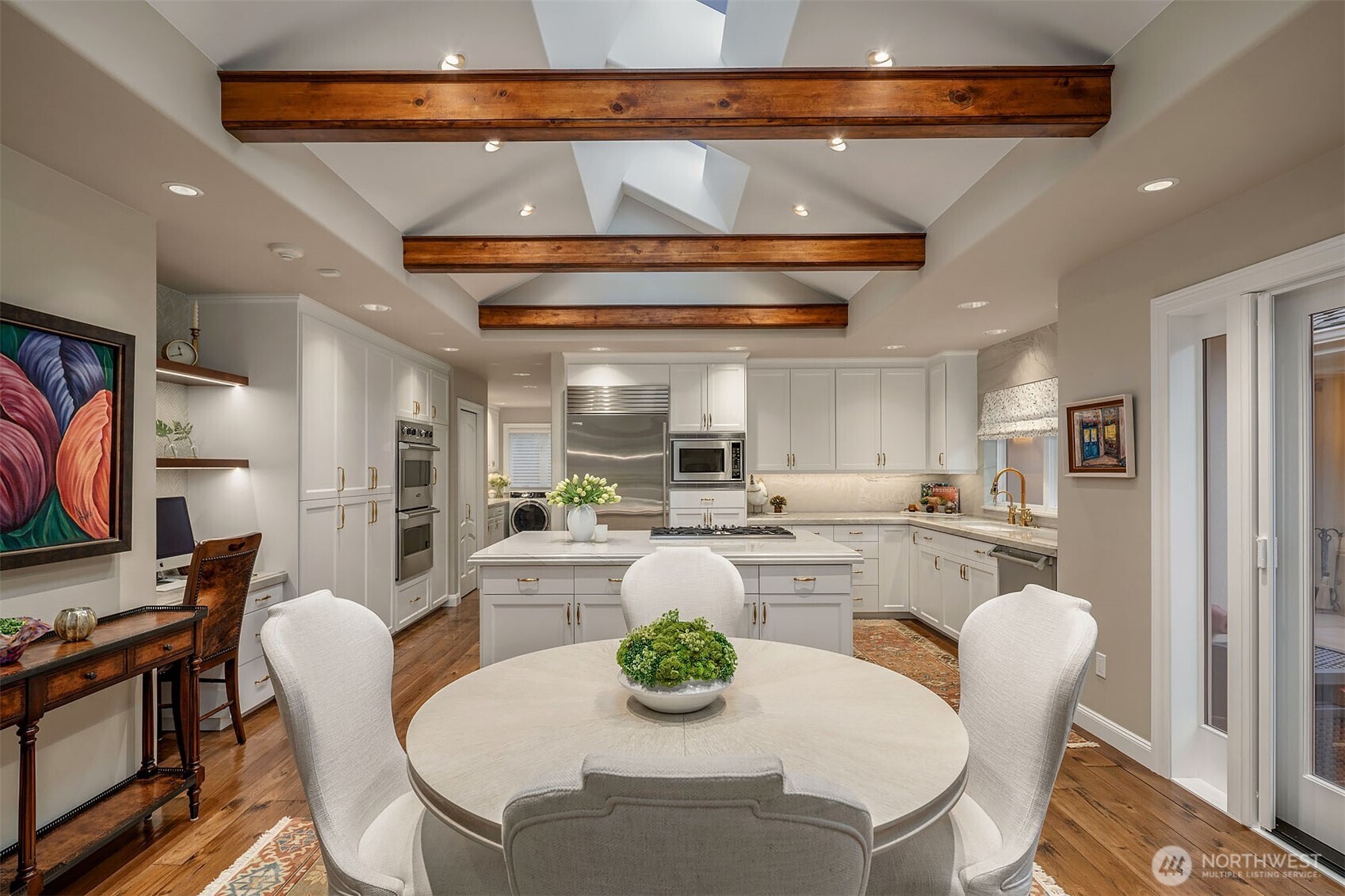 854 Evergreen Point Road Medina, WA 98039 - Photo 8 of 40 a dining room with furniture and a kitchen view