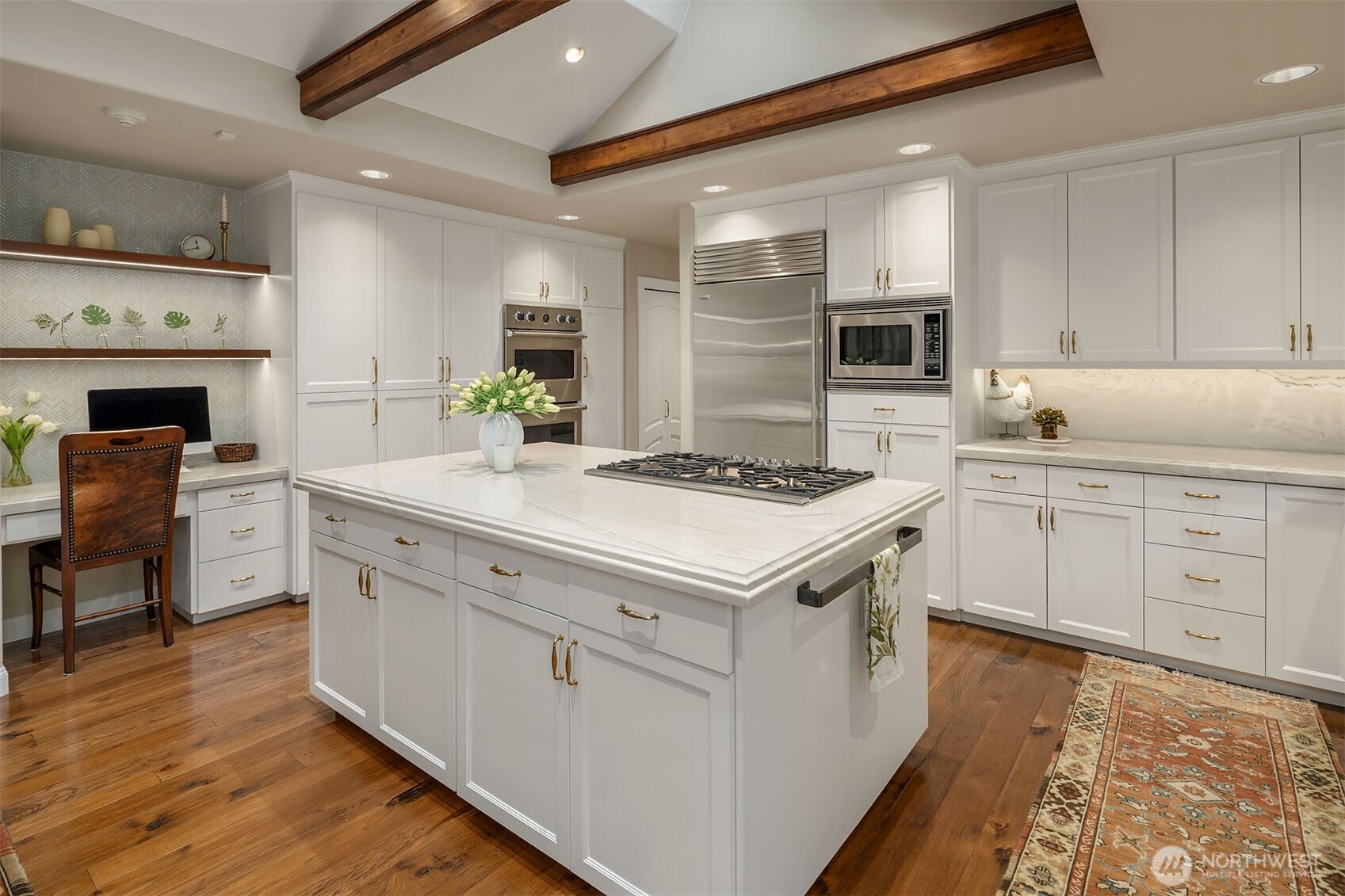 854 Evergreen Point Road Medina, WA 98039 - Photo 9 of 40 a kitchen with white cabinets and appliances