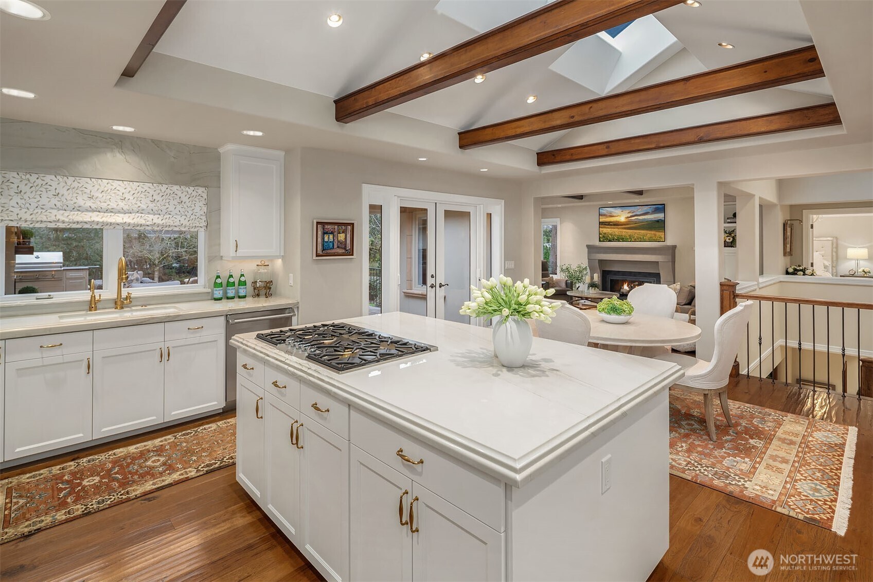 854 Evergreen Point Road Medina, WA 98039 - Photo 10 of 40 a kitchen that has a lot of white cabinets and stainless steel appliances