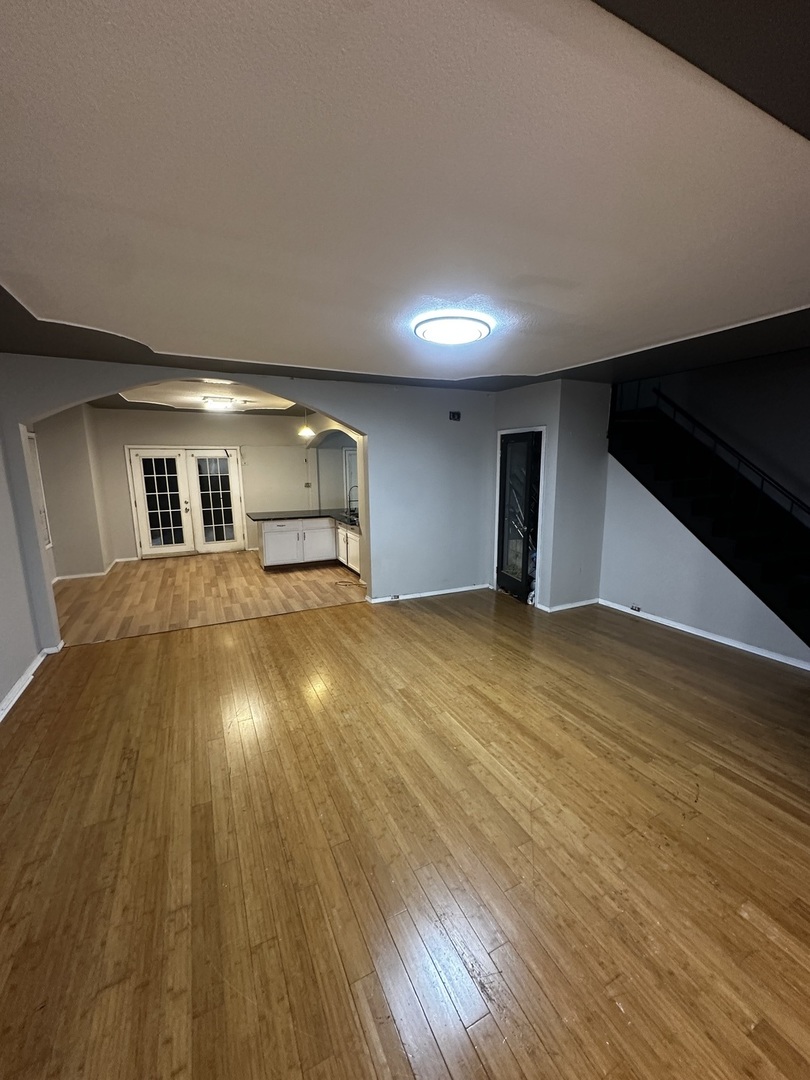 435 South Poplar Avenue Kankakee, IL 60901 - Photo 15 of 45 a view of a livingroom with wooden floor and an entrance