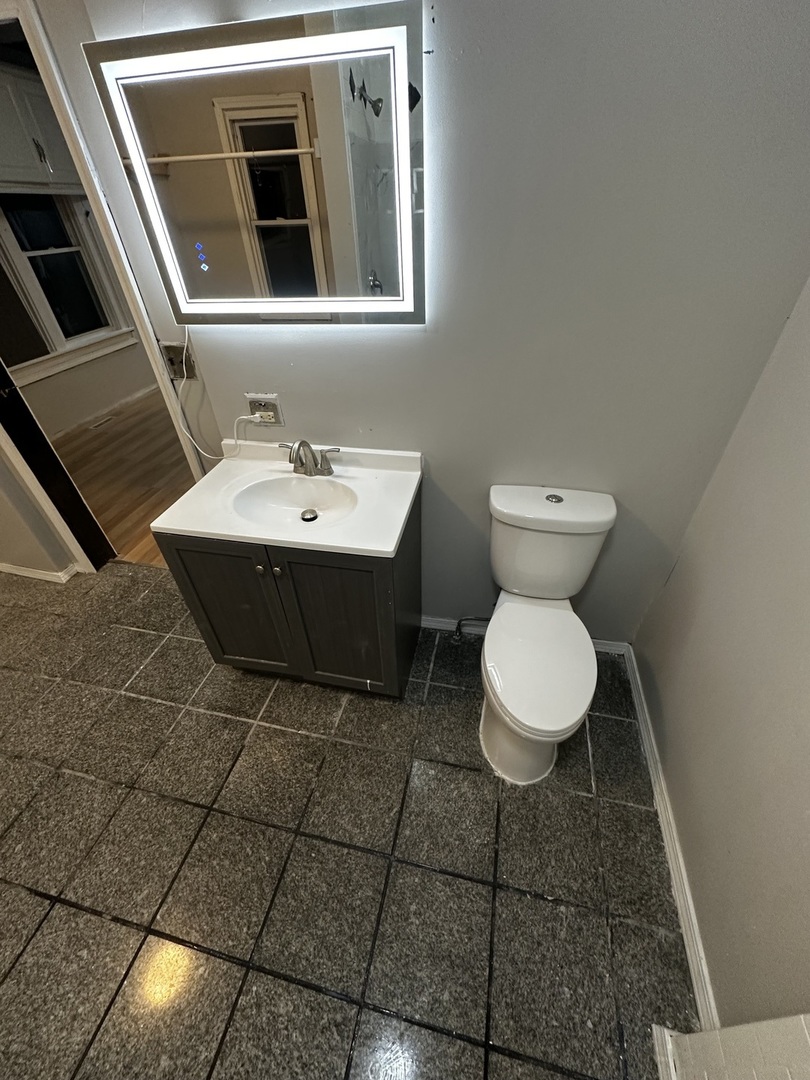 435 South Poplar Avenue Kankakee, IL 60901 - Photo 22 of 45 a bathroom with a sink and a toilet