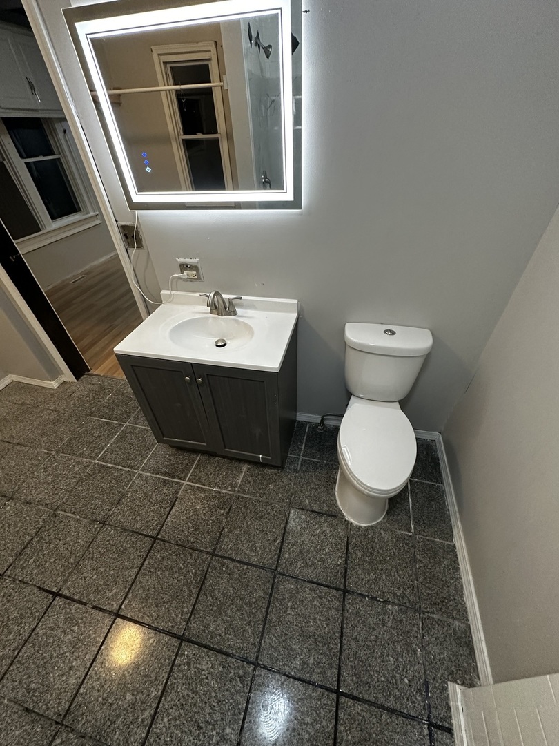 435 South Poplar Avenue Kankakee, IL 60901 - Photo 23 of 45 a bathroom with a sink and a toilet