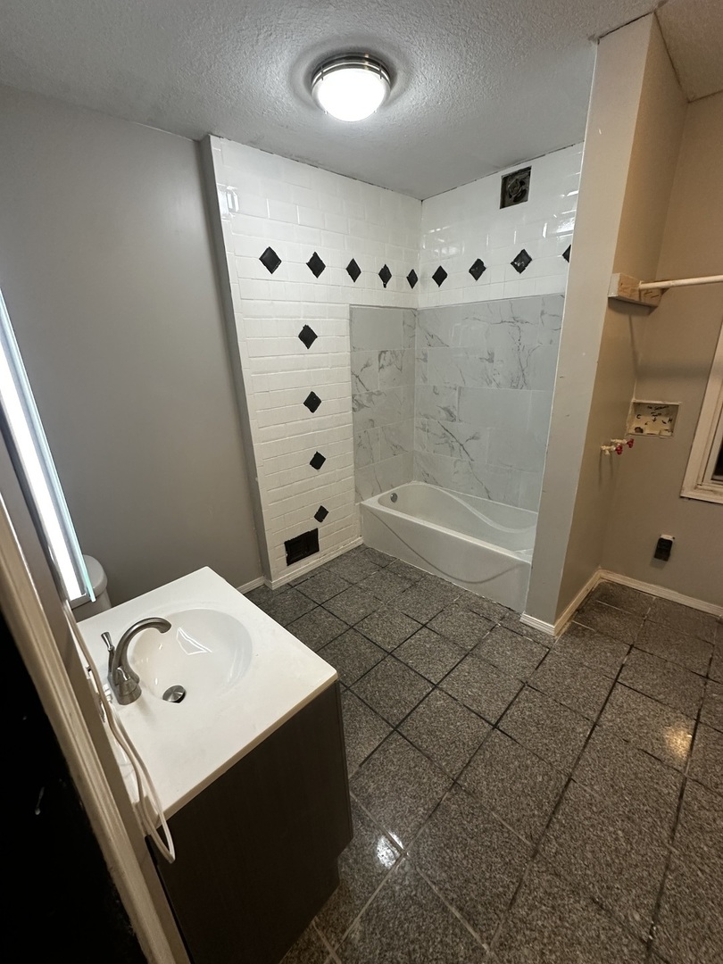 435 South Poplar Avenue Kankakee, IL 60901 - Photo 30 of 45 a bathroom with a sink and a mirror