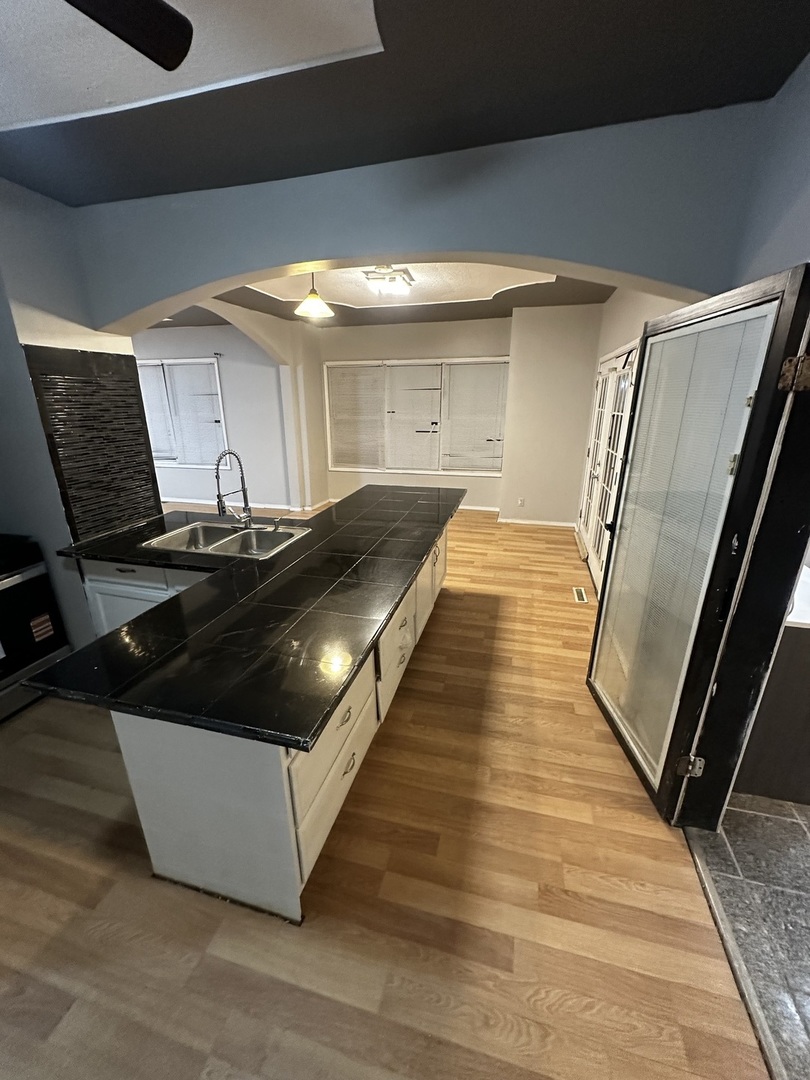 435 South Poplar Avenue Kankakee, IL 60901 - Photo 31 of 45 a kitchen with granite countertop a stove and a refrigerator