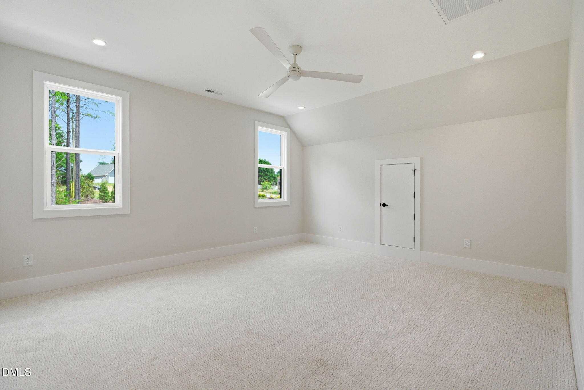 1304 Sanctuary Pond Drive Raleigh, NC 27606 - Photo 29 of 52 an empty room with windows and closet