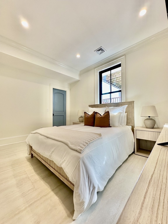 6 Douglas Street, Unit 1L Boston, MA 02127 - Photo 13 of 16 a bedroom with bed and window