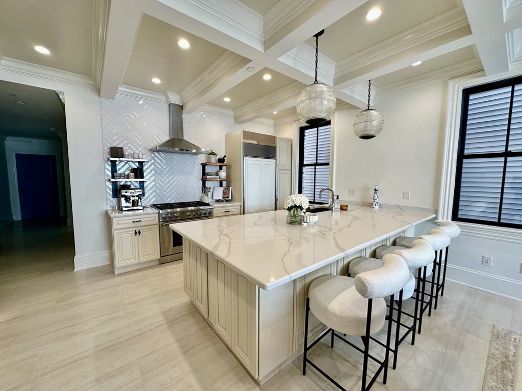 6 Douglas Street, Unit 1L Boston, MA 02127 - Photo 2 of 16 a large kitchen with a table and chairs