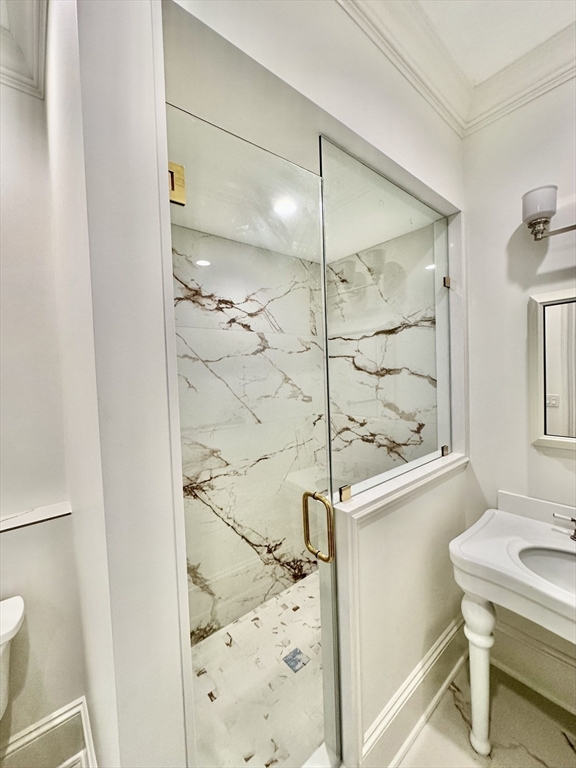 6 Douglas Street, Unit 1L Boston, MA 02127 - Photo 7 of 16 a bathroom with a shower and a sink