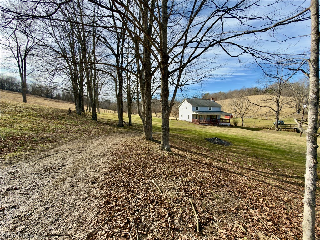 17377 Murphy Road Amesville, OH 45711 - Photo 7 of 43 View of green lawn featuring a rural view