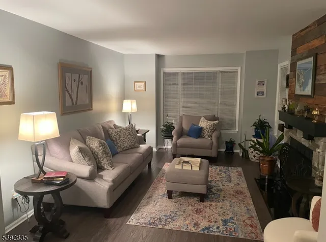 a living room with furniture and a lamp