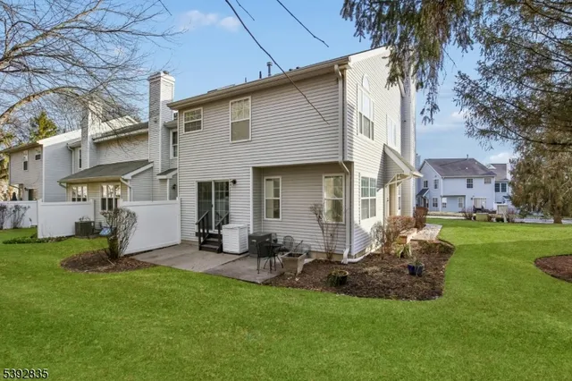 a front view of house with yard and outdoor seating