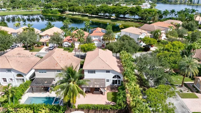 an aerial view of a house with a lake view