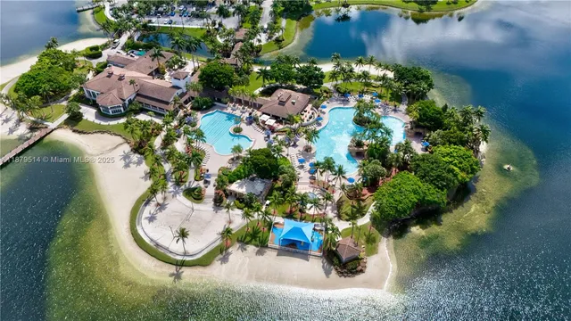 an aerial view of a house with a yard and garden